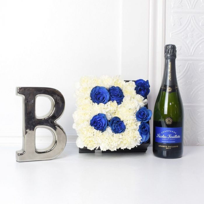 Baby Boy Celebration Flower Box in Letter B with Blue Roses and Champagne – gift basket with flower box, white and blue flowers and champagne