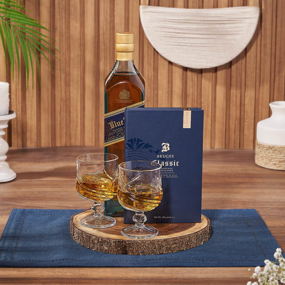 Live Edge Board Liquor Basket – gift basket with bottle of whiskey, bruges book blue and 2 astana glass cups