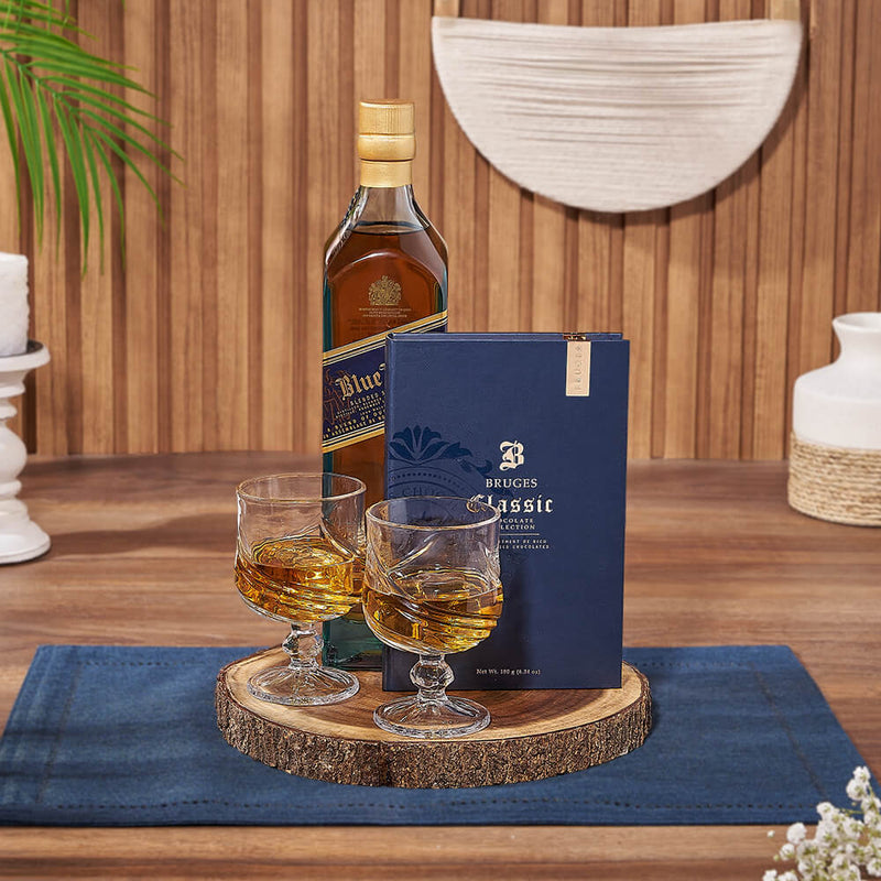 Live Edge Board Liquor Basket – gift basket with bottle of whiskey, bruges book blue and 2 astana glass cups