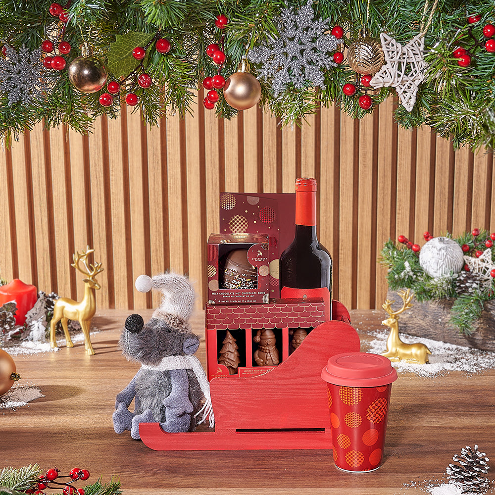 Holiday Wine Gift Basket in Red Wooden Sled with Hollyberry Chocolates – gift basket with bottle of wine, hollyberry dark chocolate envelope bar
